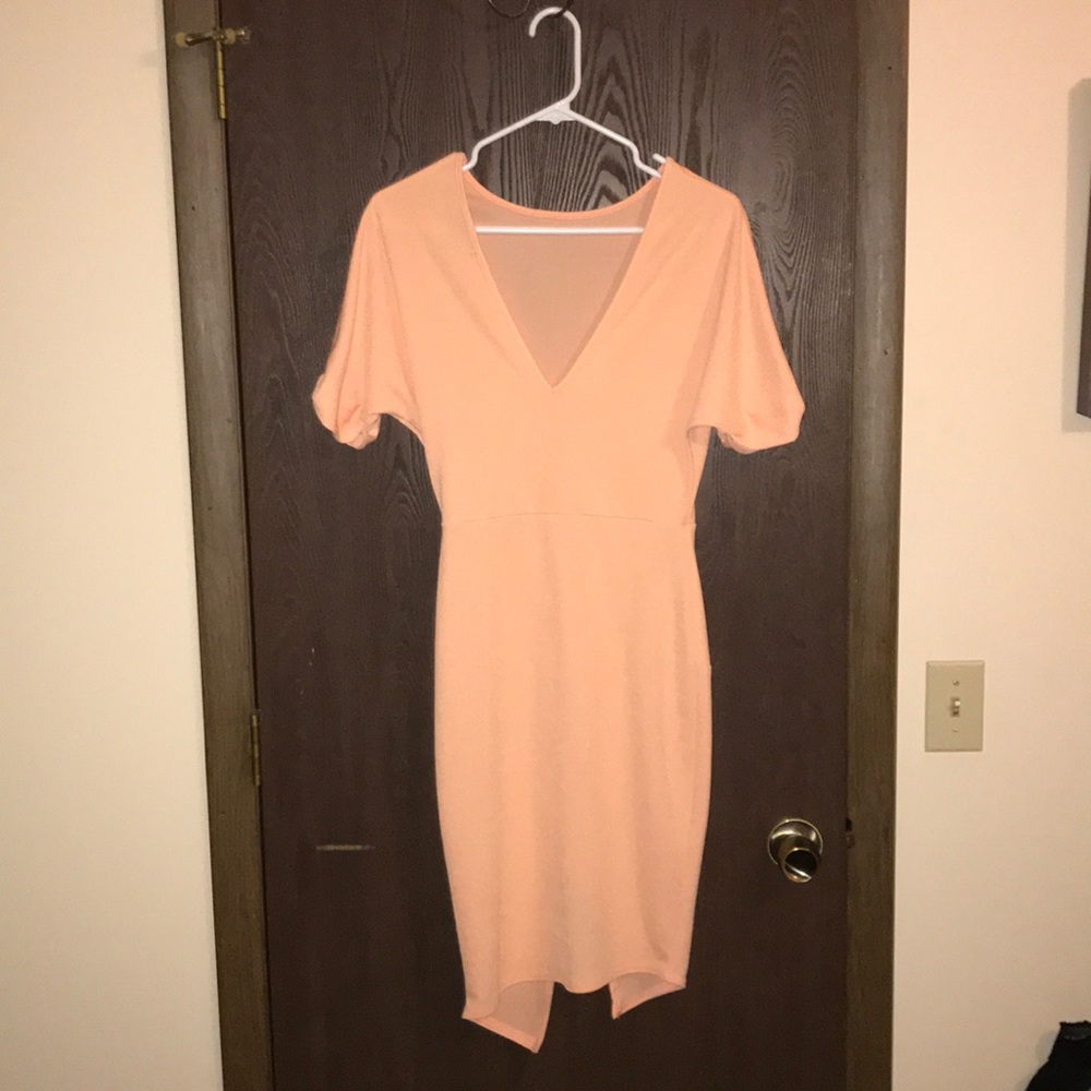 Orange form fitting midi dress